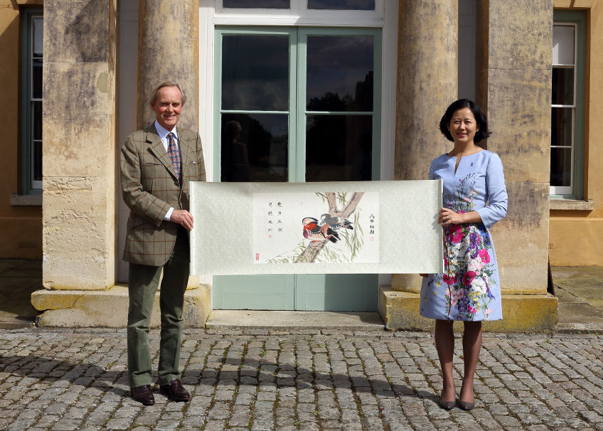 Joy Qiao, Chair of the Board of Governors for Wellington College China presented the Duke of Wellington a traditional Chinese painting and poem by Macey, a Year 8 pupil at Wellington College International Tianjin